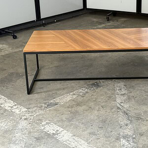 Cheery wood top with black metal frame, 45" wide, versatile accent table.