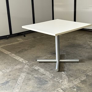 Herman Miller square break room table with white top and silver base, 36" wide, ideal for office bre.