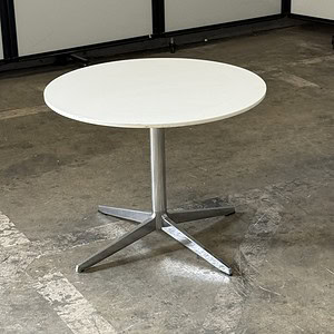 Herman Miller round table with white top and chrome base, 26.5"Wx20.5"T.