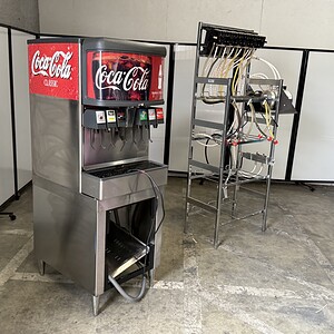 Lancer ice beverage dispenser with 6 nozzles, rack, and compressor for commercial drink service.