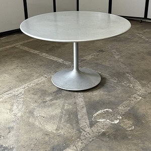 Silver metal outdoor round table, 48 inches diameter, ideal for patio or garden seating.