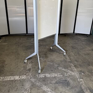 Egan mobile whiteboard, 34"Wx27"Dx75"T, with a white surface and rolling stand for easy mobility.