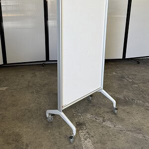 Egan mobile whiteboard, 36" wide by 24" deep, with a white surface and casters for easy mobility.