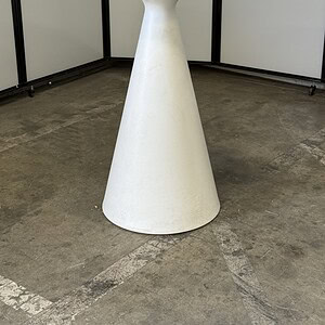 White bar height table with a sleek, modern design, perfect for commercial or residential spaces.