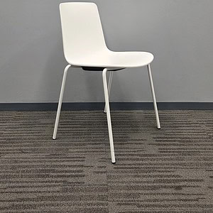 White stackable guest chair, ideal for office and conference room seating.