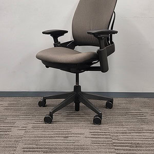 Office chair with ergonomic design, neutral fabric, and adjustable features for comfort and support.