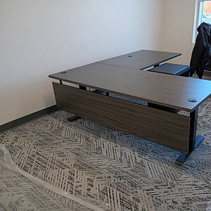 OFS L Shape HAT Desk featuring a modesty panel in white, silver, or black finish, ideal for modern o.