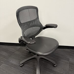 ReGeneration ergonomic office chair with black mesh back and chrome accents for comfort and style.