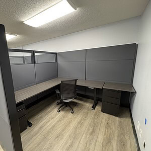 Modern Ethospace 70” tall L-shaped office cubicles in charcoal and black.