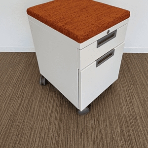 White BF Peds with Orange Cushion for ergonomic comfort and style.