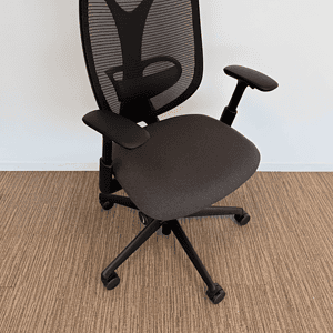 Office ergonomic mesh chair with adjustable armrests and lumbar support.