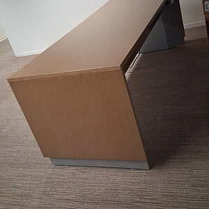 Office desk with honey maple finish, 7 feet long and 30 inches wide, ideal for professional workspac.