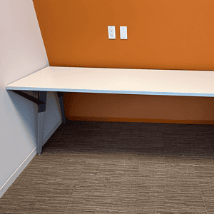 White 7’x2’ desk with sleek silver legs, ideal for modern offices and workspaces. Perfect for produc.