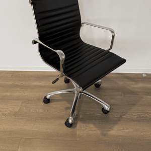 Herman Miller Eames style black conference chair with chrome accents.