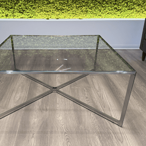 Glass and steel coffee table with sleek design, perfect for contemporary living spaces.
