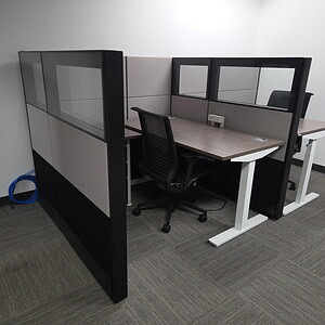 Modern office cubicles with Ethospace black and silver HAT table setup.