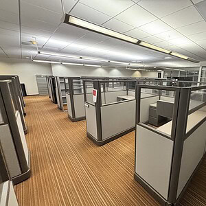 Modern Herman Miller A02 half glass office cubicles in a professional workspace.