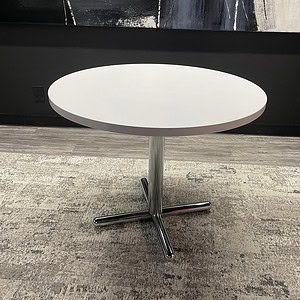 White round Kimball breakroom table with chrome base for office or breakroom use.