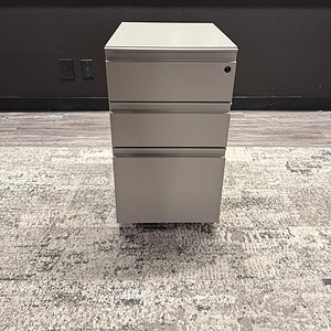 Silver mobile storage pedestal for office organization and storage solutions. Durable, 18-inch deep.