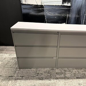 Double 3-drawer lateral file cabinet with a sleek white top, ideal for office storage and organizati.