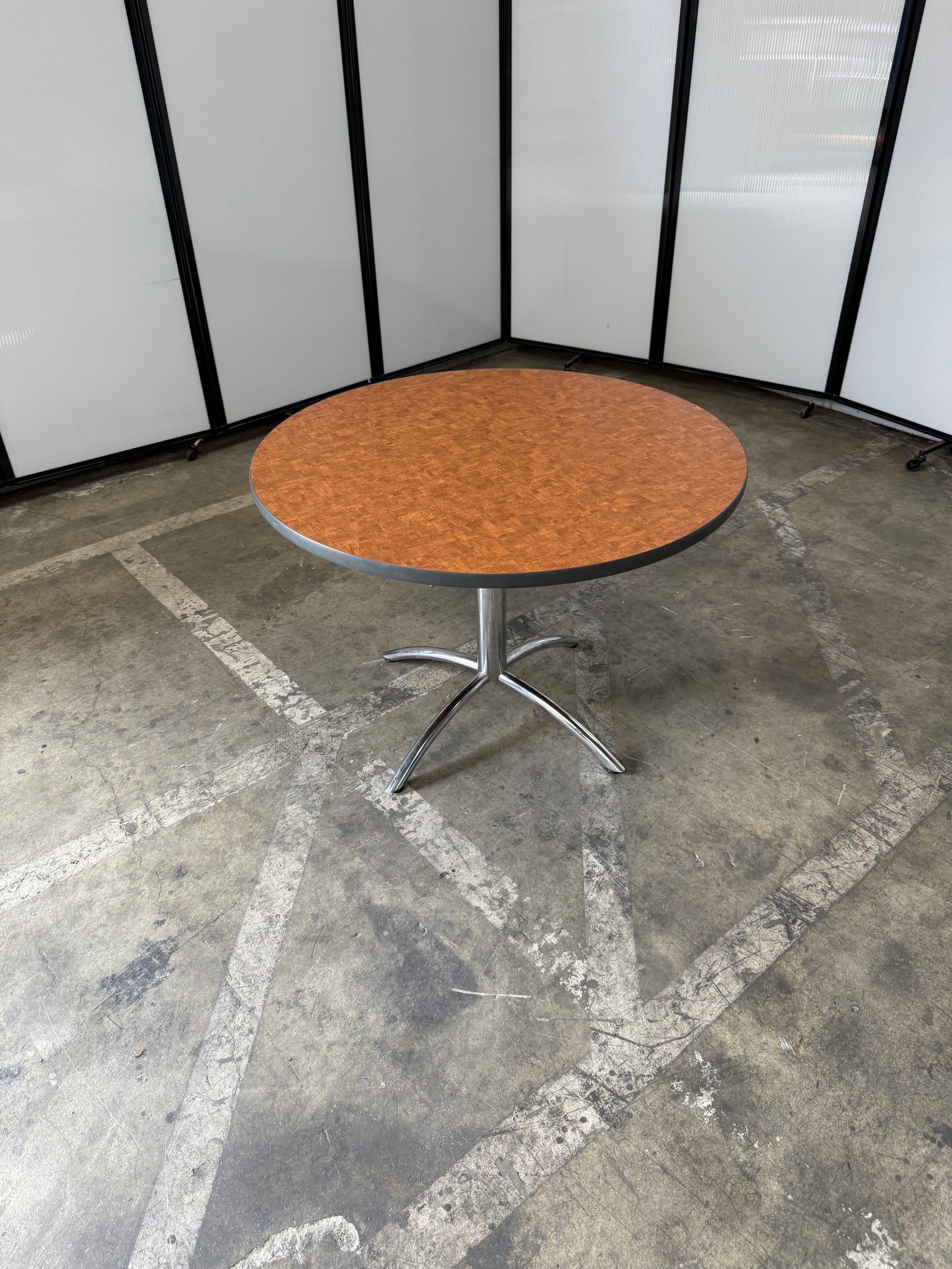 Herman Miller Natural wood laminate round table with chrome base 42"W