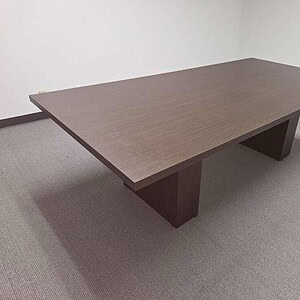Conference table with a sleek, modern design, perfect for corporate meeting rooms.