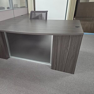 Double Pedestal Desk with Glass Modesty Panel for Office Spaces.