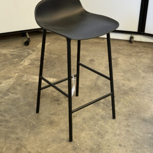 Black counter height stool with curved seat and metal legs, ideal for modern kitchen or bar area.