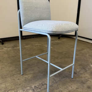 Contemporary light gray fabric bar stool with metal frame, ideal for modern interiors.