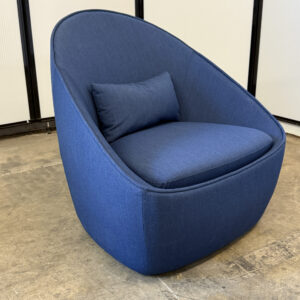 Navy blue egg-swivel lounge chair with pillow cushion for modern seating.