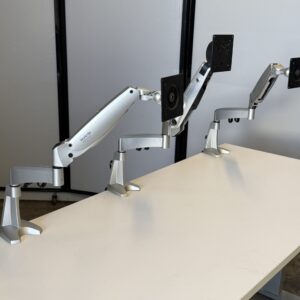 Workrite Swing single monitor arm for ergonomic workspace setup.