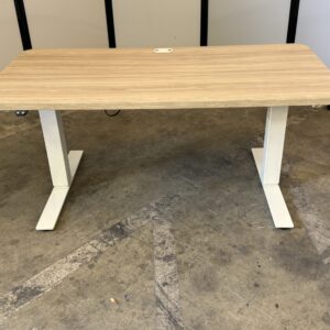 Haworth Hop electric desk with white frame and walnut rectangle top for modern office spaces.
