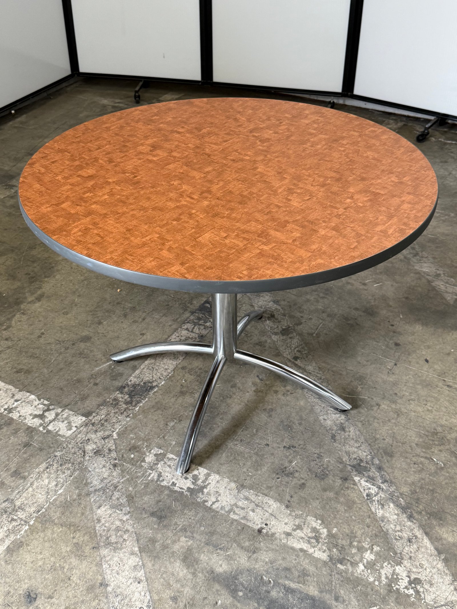 Herman Miller Natural wood laminate round table with chrome base 42"W