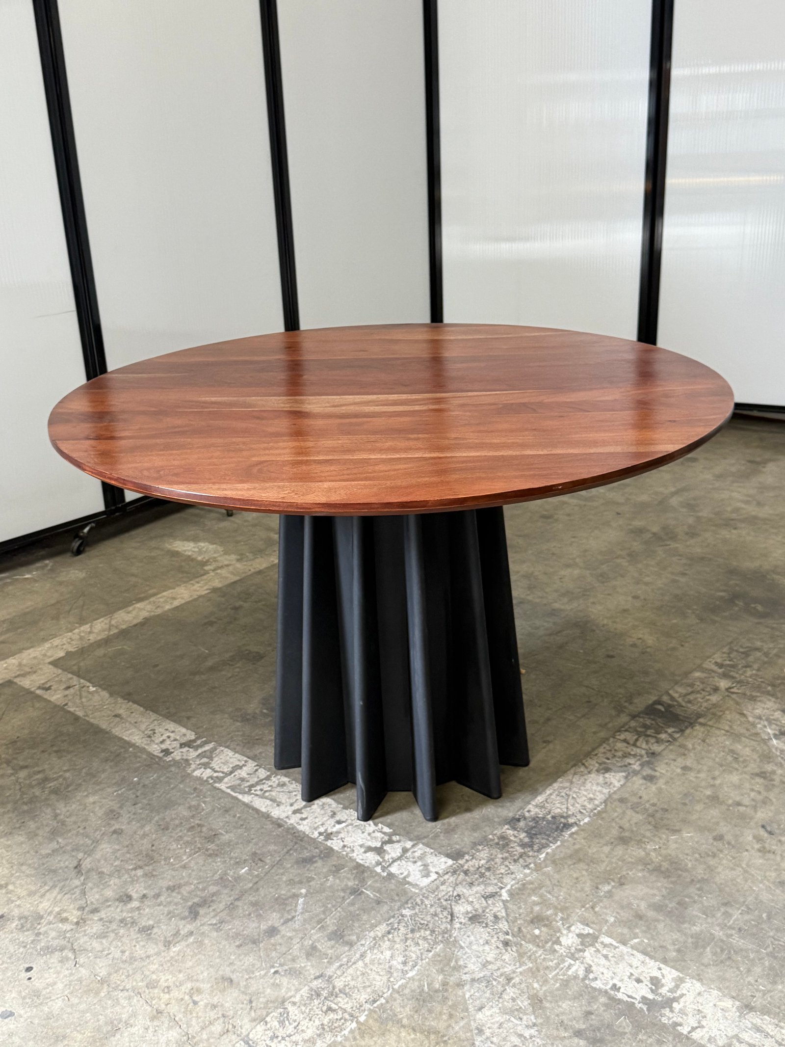 Andreu World round American oak with black metal base 48"Wx29.5"T