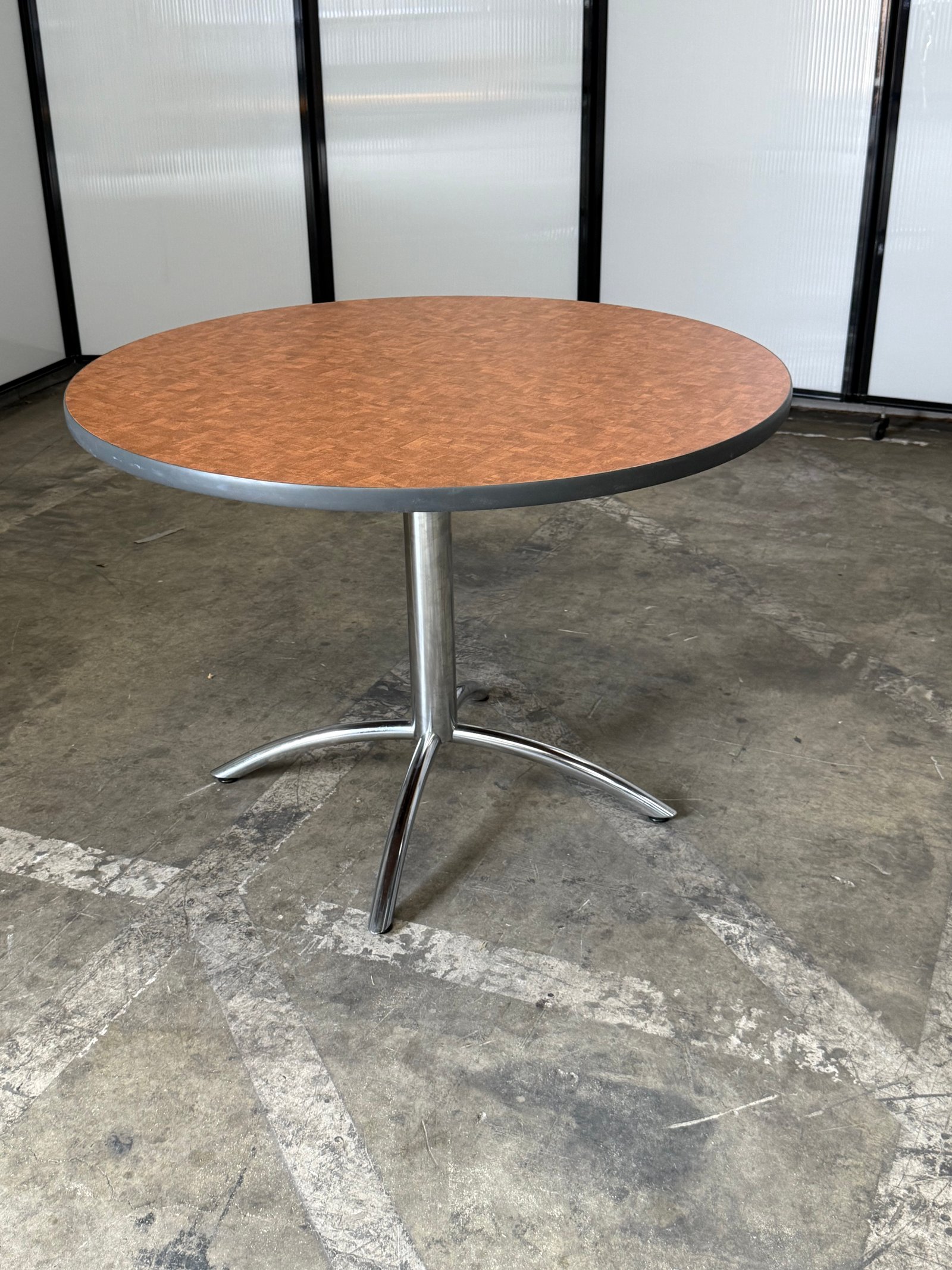 Herman Miller Natural wood laminate round table with chrome base 42"W