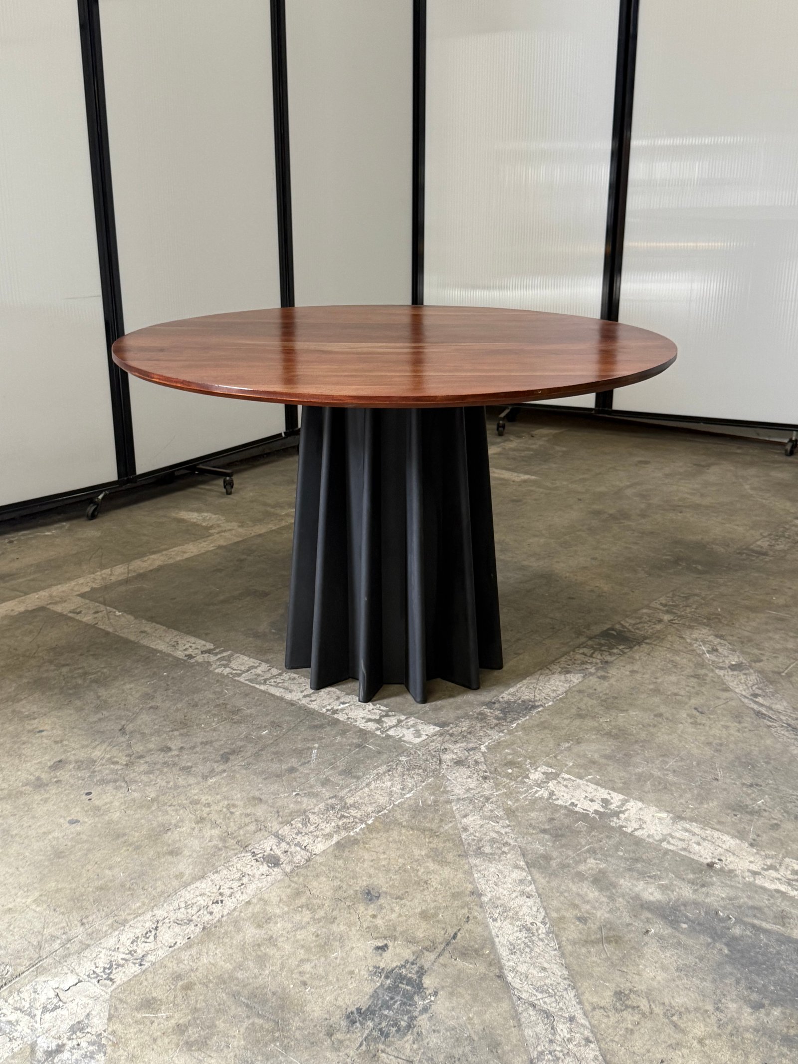 Andreu World round American oak with black metal base 48"Wx29.5"T