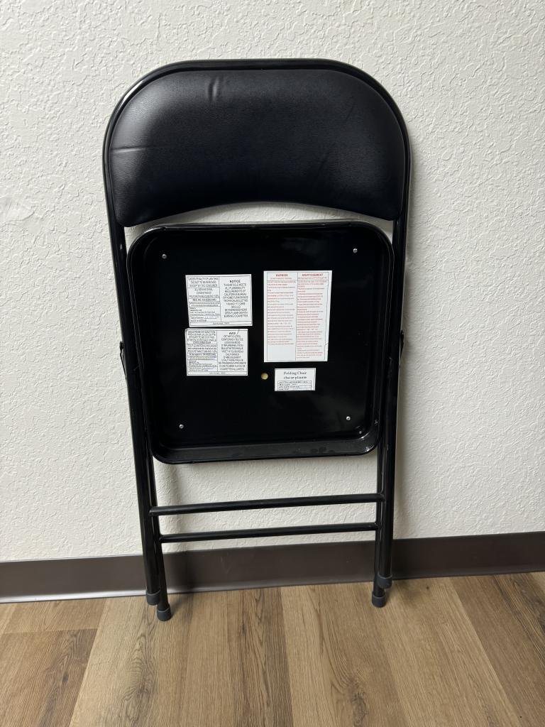 Black folding chairs metal base vinyl seat.