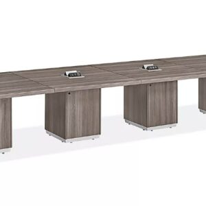 Office conference table with integrated power and data ports for meetings.