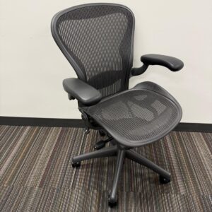 Ergonomic mesh office chair with adjustable armrests and breathable backrest.