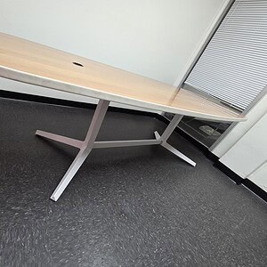 Haworth 84x36 walnut and white oval table with steel legs.