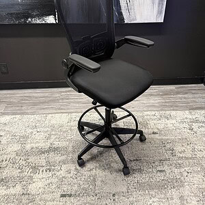 Black ergonomic bar stool with adjustable height and armrests.