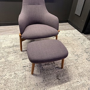 Comfortable purple lounge chair with matching foot rest for modern living rooms.