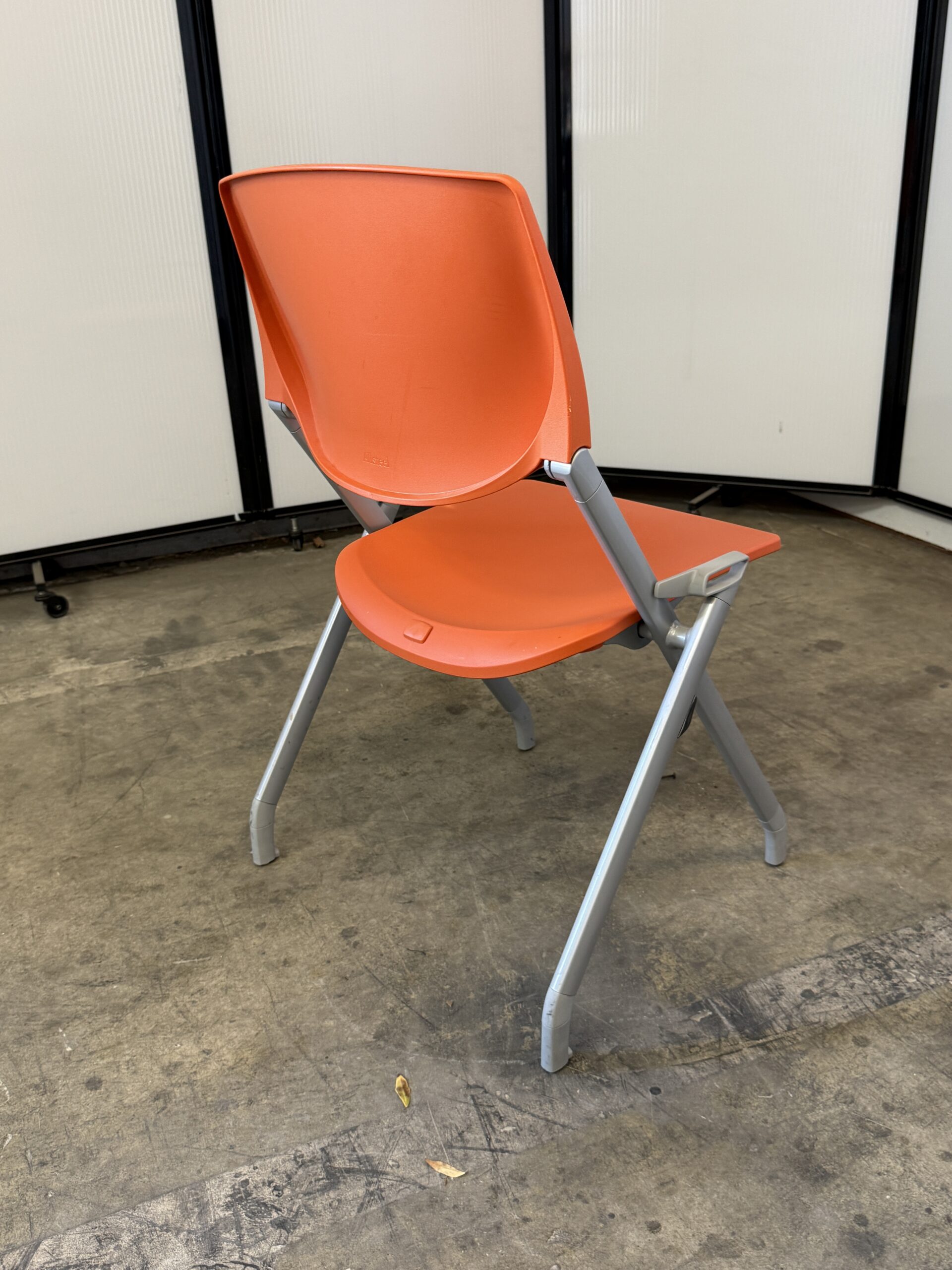 Allsteel stationary nesting chair in orange.