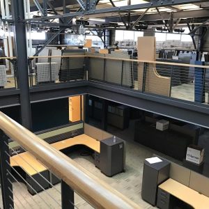 Installation of custom cube structures for commercial spaces.
