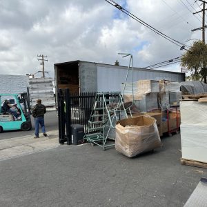 Warehouse with pallets and forklift for nationwide and international shipping.