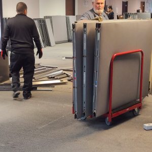 Professional installation of modular panels at Cube World USA.