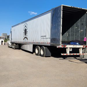 Large shipping truck with open rear door for nationwide and international freight.