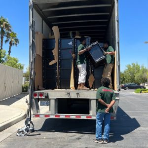Moving equipment being unloaded from a truck for a relocation project.