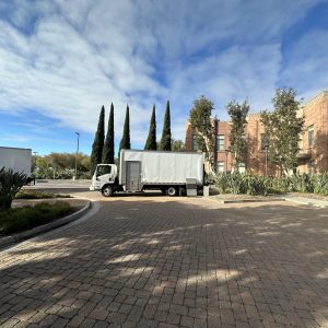 Commercial moving truck parked outside for nationwide and international shipping services at Cube Wo.