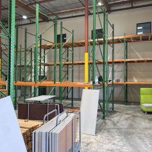 Installation of industrial shelving units at Cube World USA.